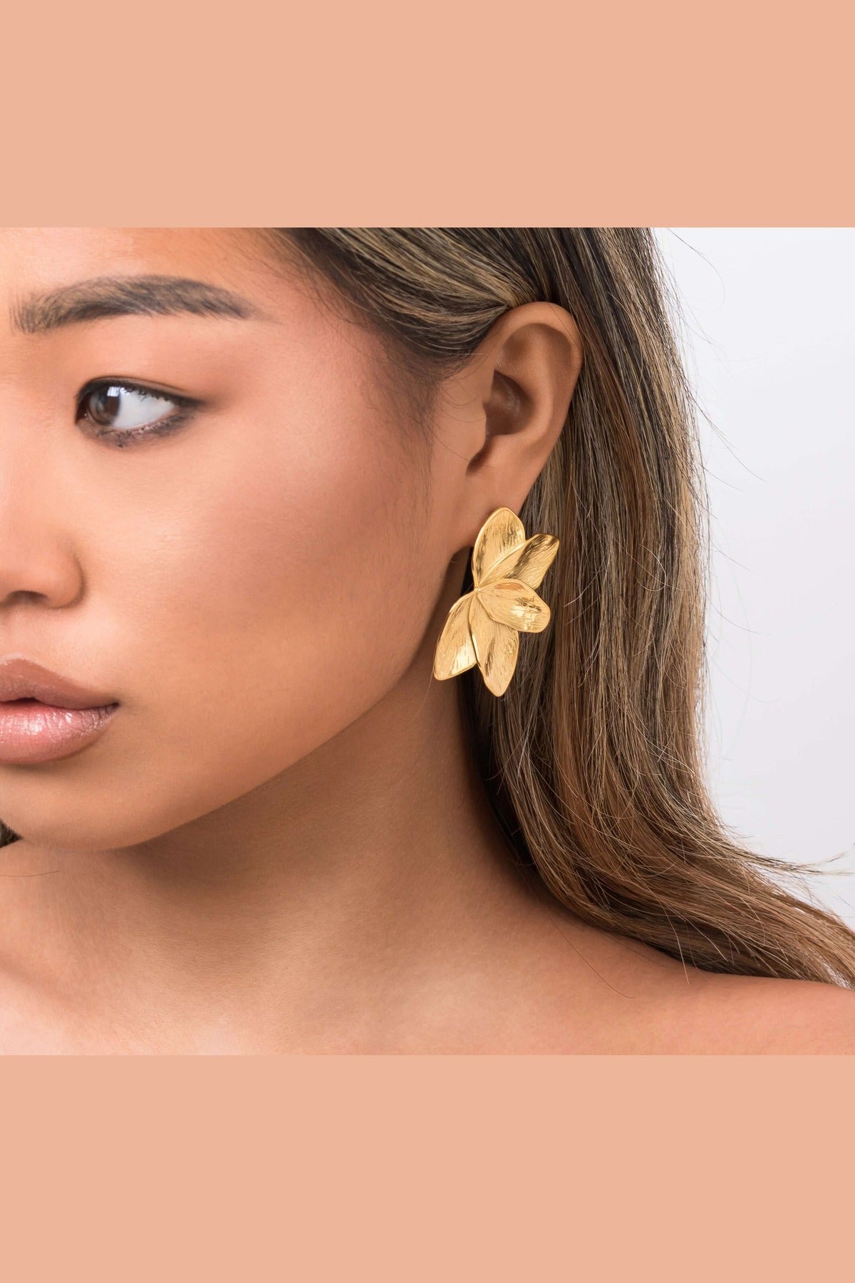 Flora Textured Bloom Stud Earrings by ARIIRA, featuring layered gold petals, capturing elegance and natural beauty.