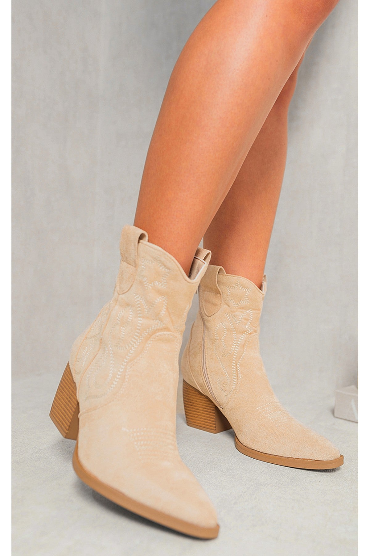 Model wearing Laura Faux Suede Cowboy Ankle Length Boots