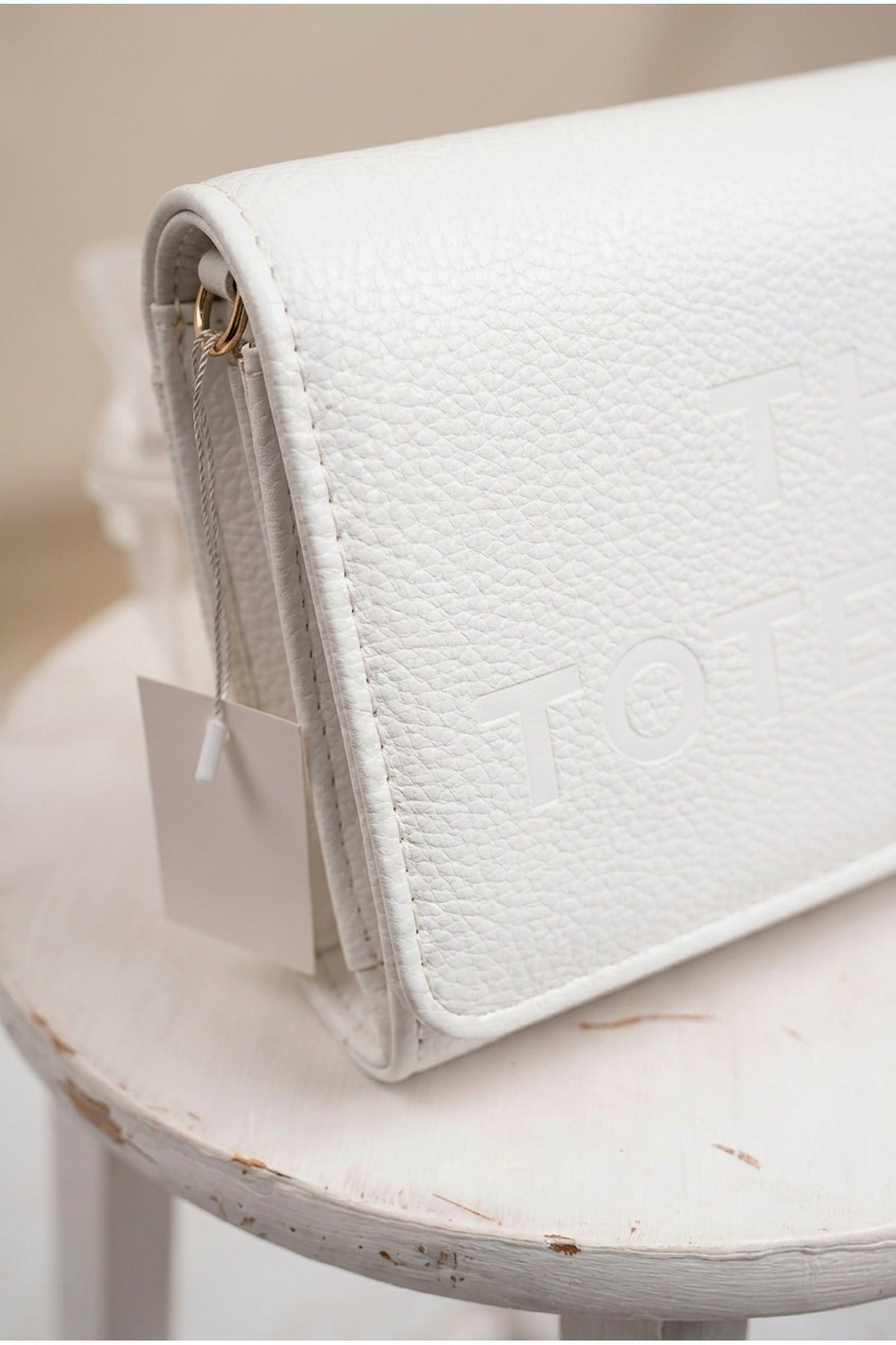 Constance Pebbled Faux Leather Text Bag - White