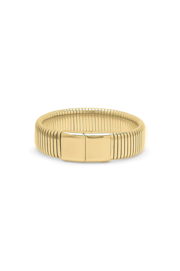 Yasira Ribbed Wide Gold Bangle Bracelet by ARIIRA, featuring a bold ribbed design and smooth clasp for elegant style.