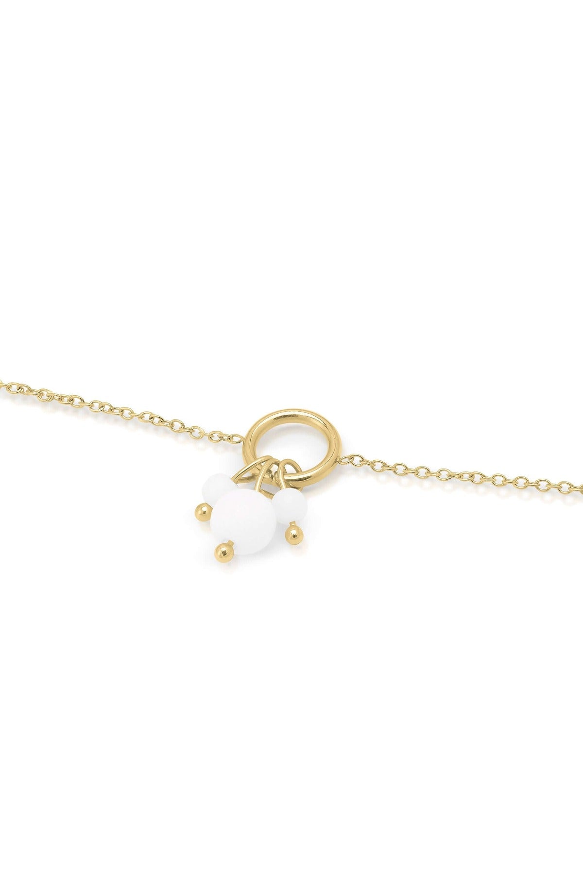 Close-up of the ARIIRA Freya Delicate Pearl Charm Anklet featuring a gold-plated chain and elegant pearl-like beads.