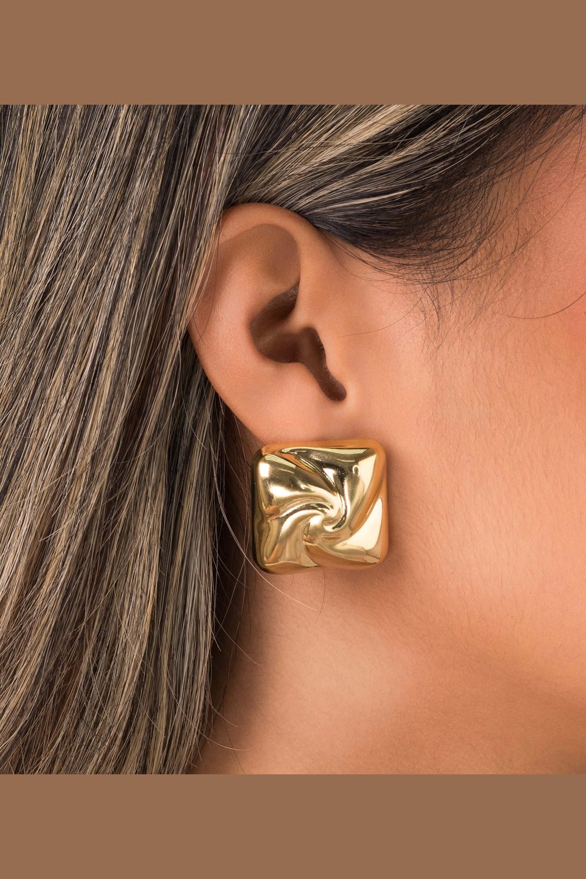 Mira Sculpted Stud Earrings by ARIIRA, showcasing a sculptural square design with polished gold finish.