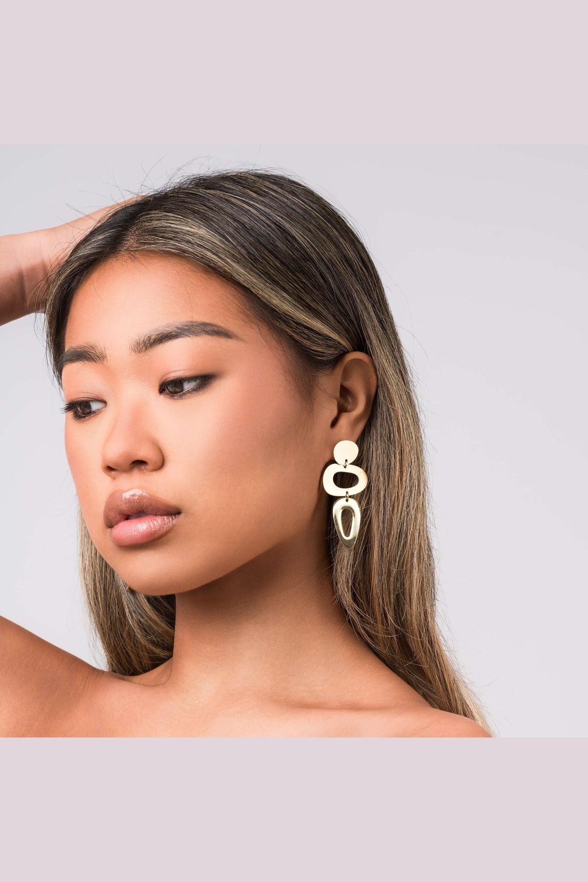 Iris Sculptural Drop Earrings by ARIIRA, featuring soft curves and bold design, perfect for self-expression and modern elegance.